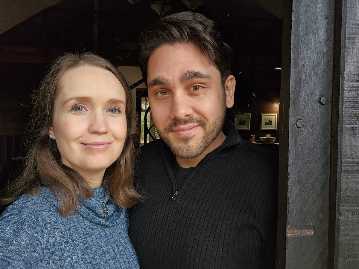 authors mateo sol and aletheia luna standing in a doorway