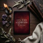 image of the soul work compass course on a table with a candle